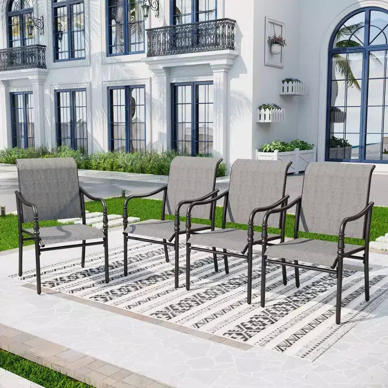Captiva Designs Ensemble de 9 pièces, table rectangulaire spacieuse en métal à lattes avec trou pour parasol et chaises fixes en acier avec accoudoirs en forme de calebasse.