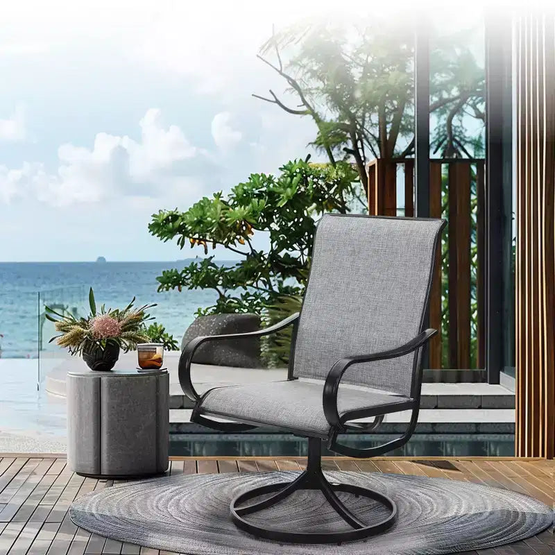 Captiva Designs, table ronde à lattes en acier noir 7 pièces avec trou pour parasol et chaises pivotantes en textilène