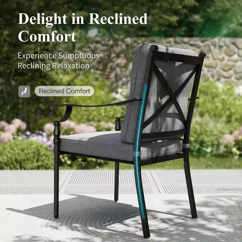 Set da pranzo da patio Captiva Designs con tavolo in acciaio a doghe e sedie in metallo con cuscini