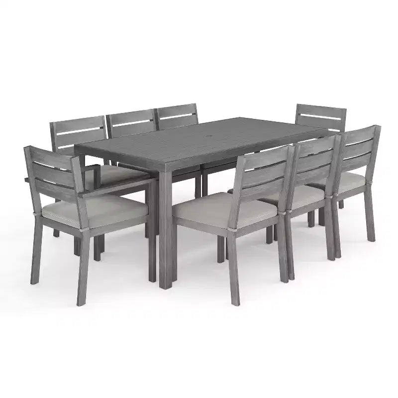 Ensemble de salle à manger d'extérieur Martha Stewart Bedford avec table de 180 cm et 8 chaises avec finition en aluminium brossé aspect bois et coussins résistants aux intempéries