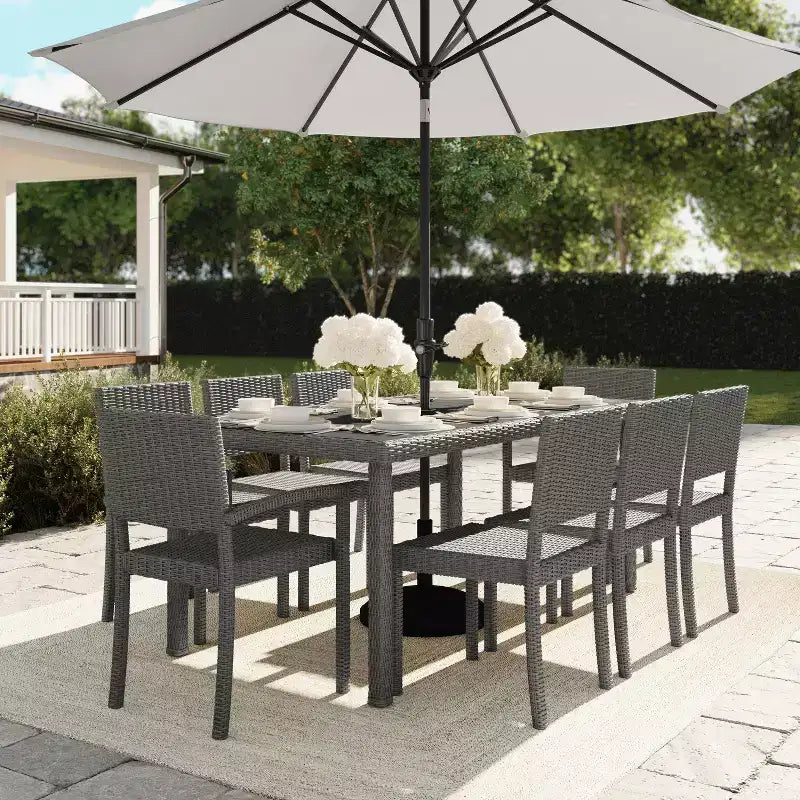 Set da pranzo per interni ed esterni Martha Stewart Bedford da 9 pezzi con 8 sedie da pranzo impilabili e tavolo da patio da 71 pollici con piano in legno composito in rattan intrecciato