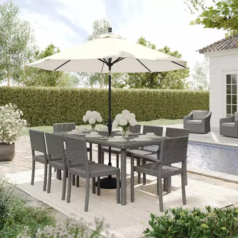 Set da pranzo per interni ed esterni Martha Stewart Bedford da 9 pezzi con 8 sedie da pranzo impilabili e tavolo da patio da 71 pollici con piano in legno composito in rattan intrecciato