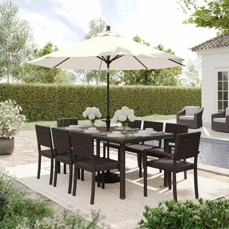 Set da pranzo per interni ed esterni Martha Stewart Bedford da 9 pezzi con 8 sedie da pranzo impilabili e tavolo da patio da 71 pollici con piano in legno composito in rattan intrecciato