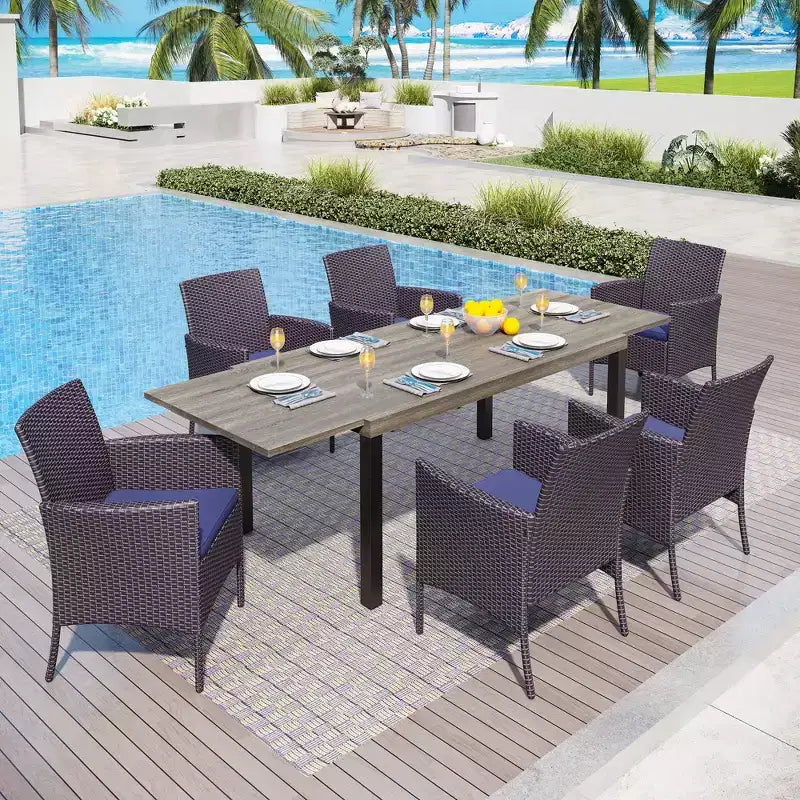 Captiva Designs - Table à manger extensible en acier 7 pièces et chaises en rotin avec accoudoirs en croissant pour l'extérieur