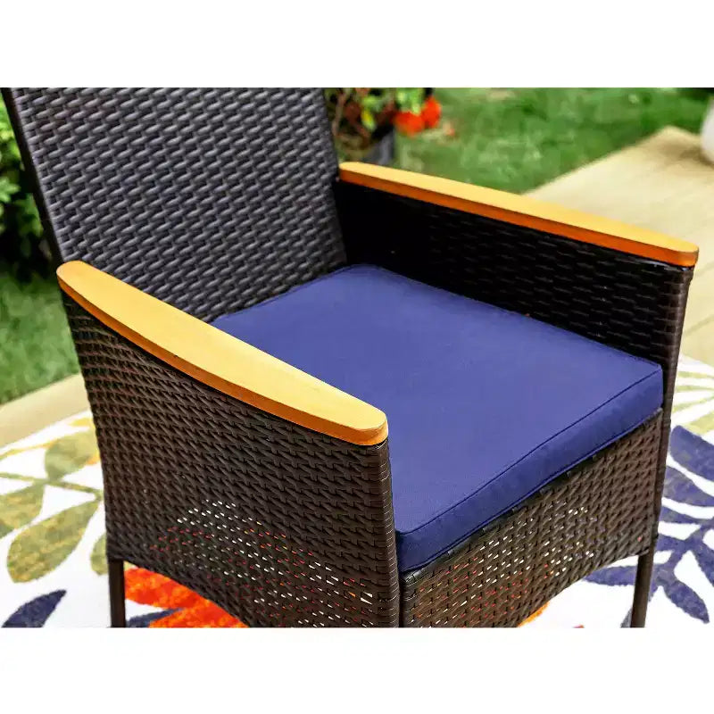 Captiva Designs Set da pranzo da 7 pezzi per esterni con tavolo in acciaio con ripiano a doghe e sedie in rattan con cuscini rimovibili