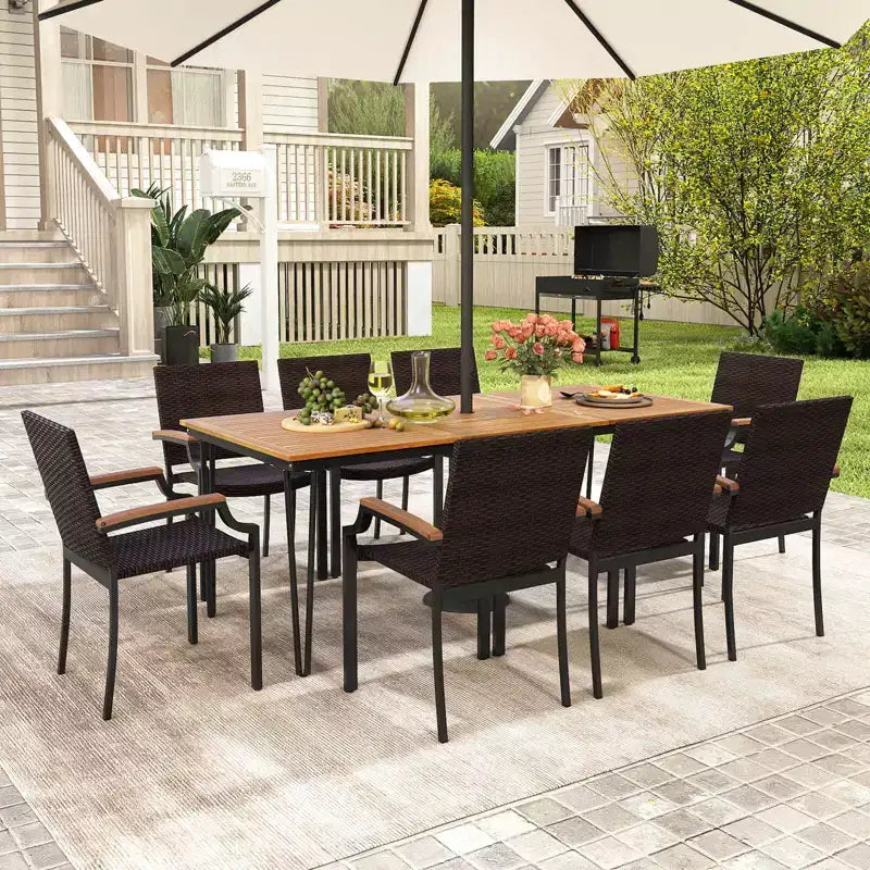 Set da pranzo da esterni Costway 9 pezzi con tavolo rettangolare da 79 pollici e 8 sedie impilabili in rattan