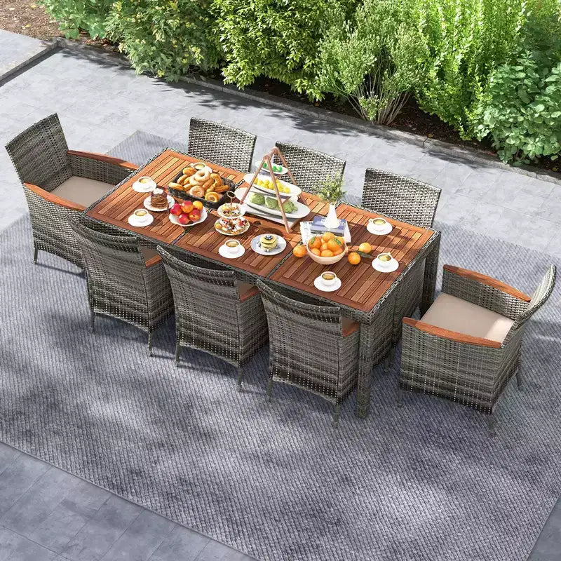 Set da pranzo da esterno in vimini a 9 pezzi Costway con tavolo in legno di acacia e 8 poltrone