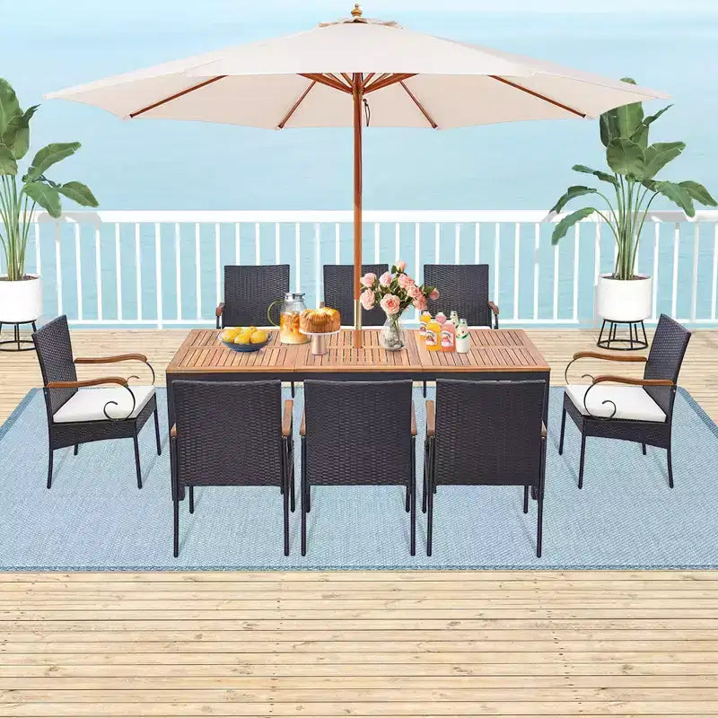 Set da Pranzo Costway 9 Pezzi in Rattan da Esterno con Tavolo in Legno di Acacia, Cuscini, Foro per Ombrellone da 1,9