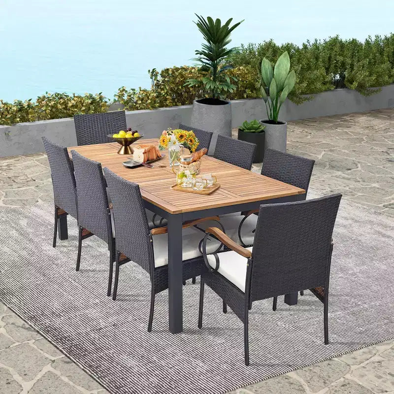 Set da Pranzo Costway 9 Pezzi in Rattan da Esterno con Tavolo in Legno di Acacia, Cuscini, Foro per Ombrellone da 1,9