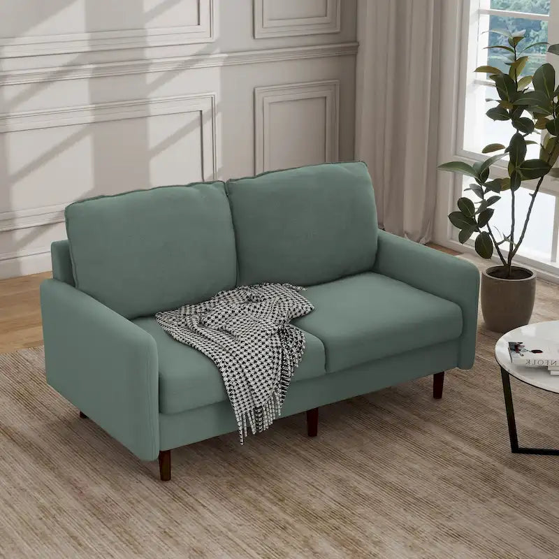 Divanetto moderno in velluto con gambe in legno