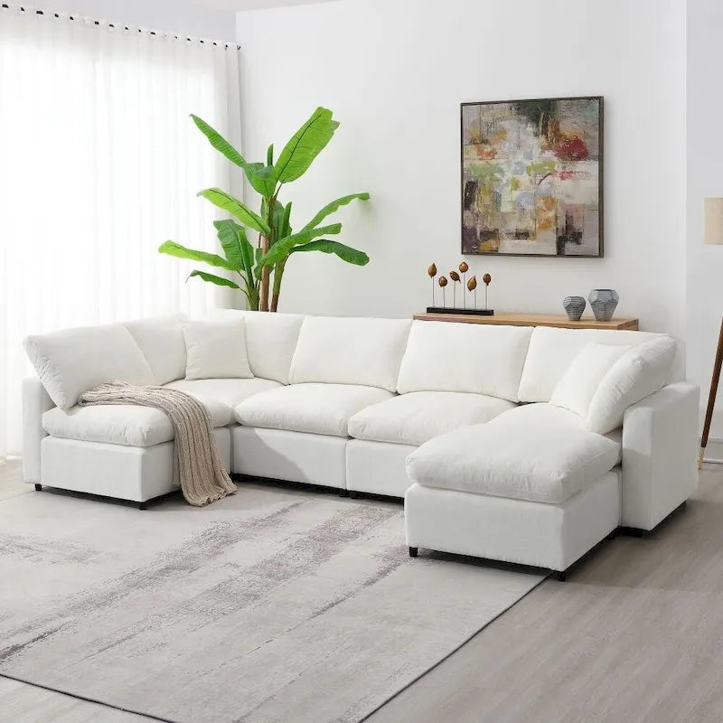Divano sezionale a U convertibile con pouf