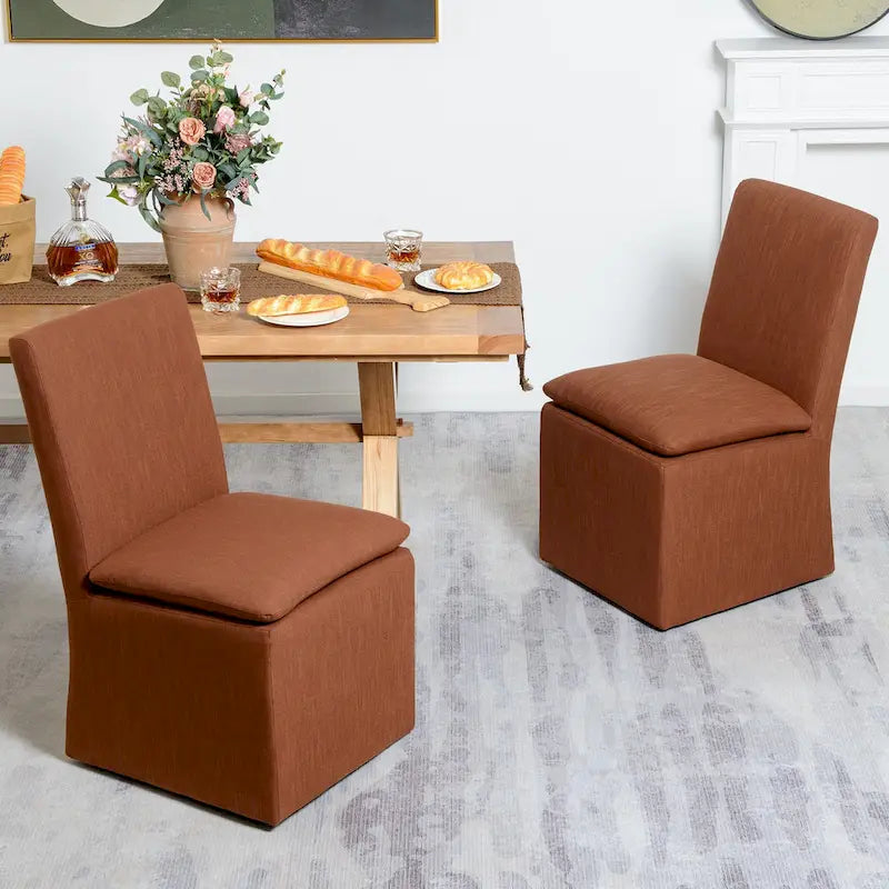 Sedia da pranzo laterale KINWELL 21 imbottita in tessuto performante con ruote (set da 2)