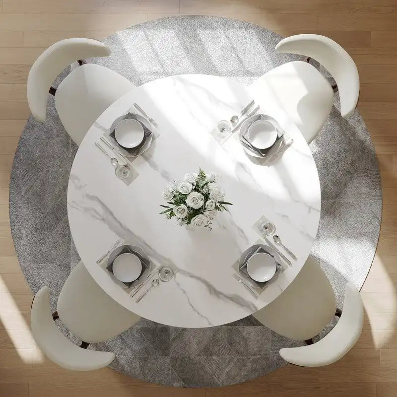Tavolo da pranzo moderno rotondo per sala da pranzoPiano in pietra lucida bianca, piedistallo in carbonio bronzo