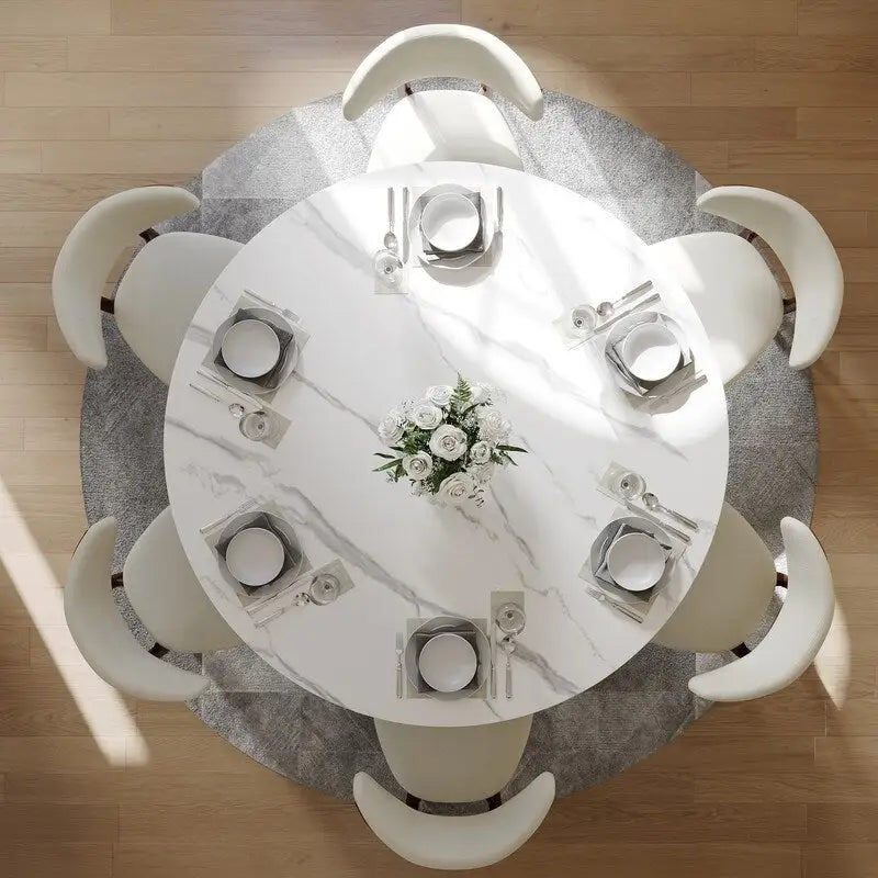 Tavolo da pranzo moderno rotondo per sala da pranzoPiano in pietra lucida bianca, piedistallo in carbonio bronzo